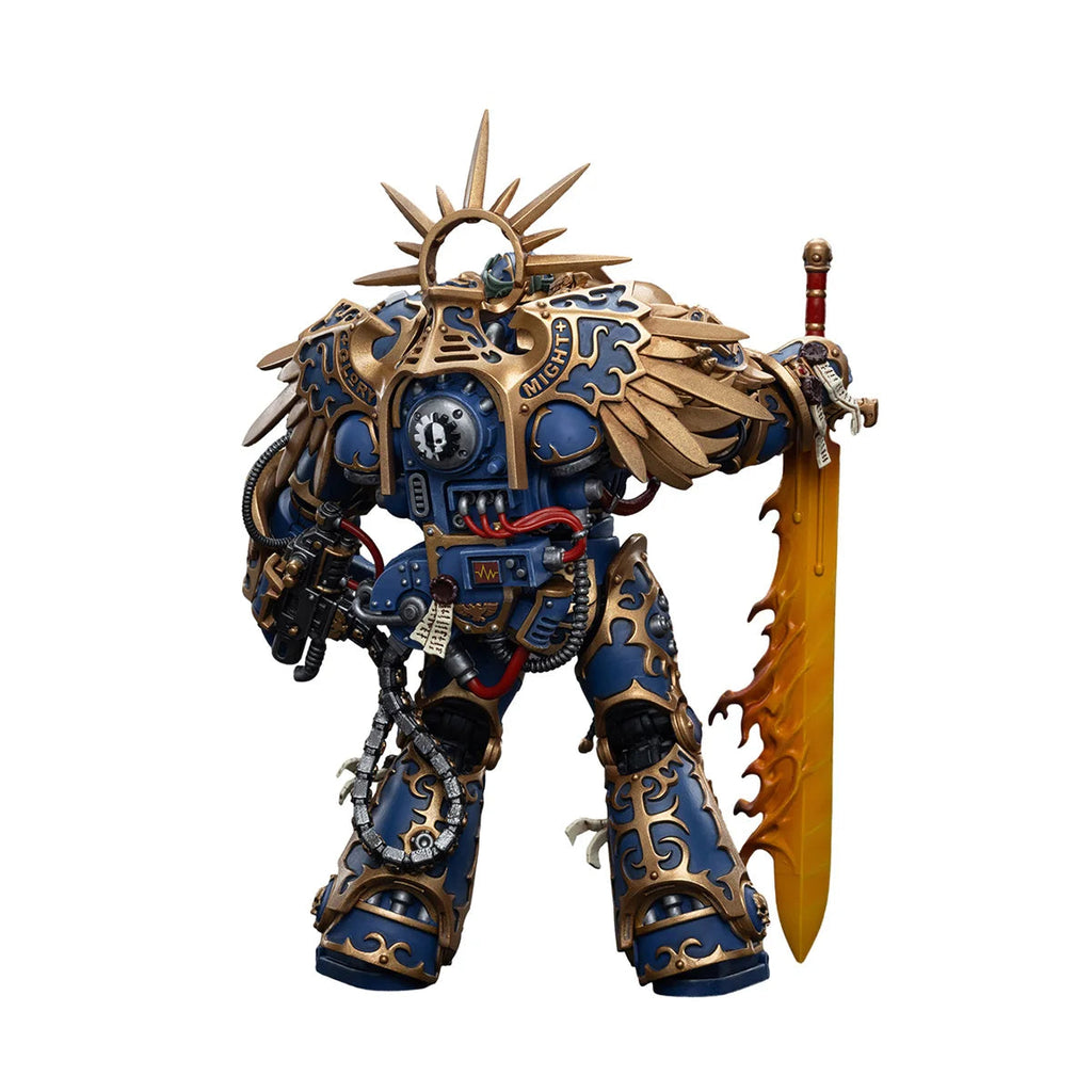 Toy figure with intricate design and sword, featuring Joytoy and Warhammer branding.